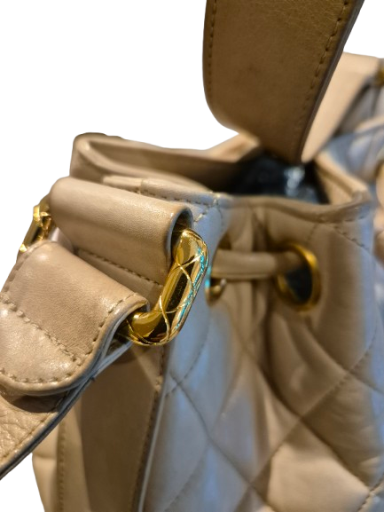 CHANEL beige quilted lamb leather hobo bucket shoulder bag with CC golden drawstrings and pouch