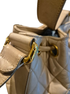 CHANEL beige quilted lamb leather hobo bucket shoulder bag with CC golden drawstrings and pouch